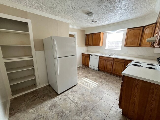 Building Photo - Denton Charmer with Big Yard, Carport & Flexible Living Space