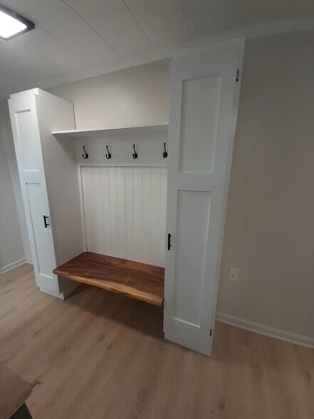 Back hallway coat rack boot bench - 227 E Hector St