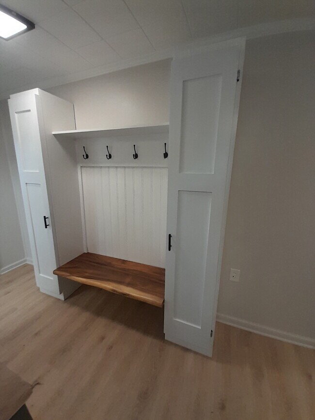Back hallway coat rack boot bench - 227 E Hector St