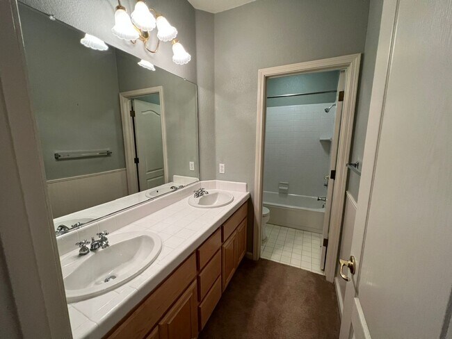 Building Photo - 4 bedrooms with 3 car garage in Rose Lane ...