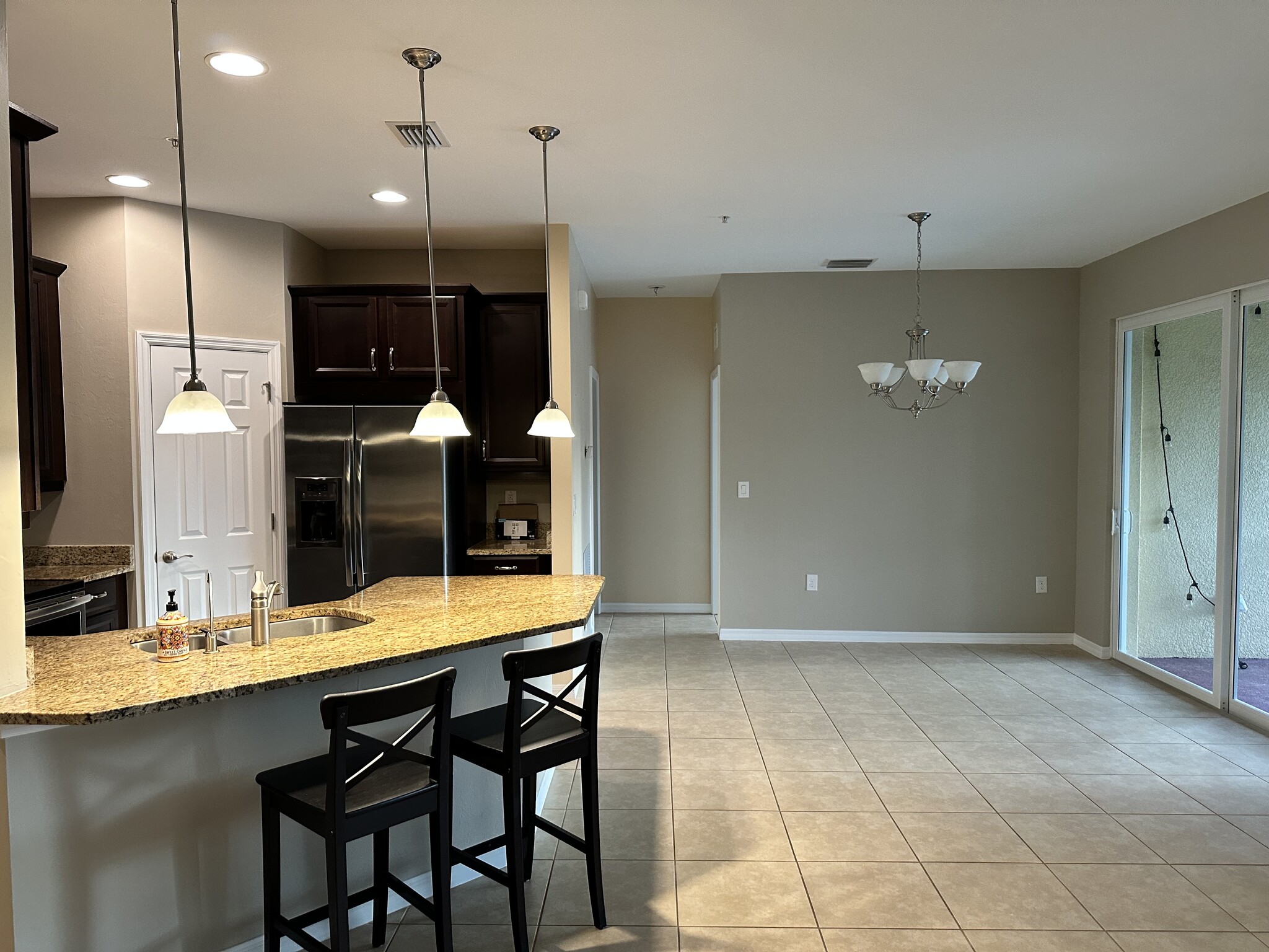 Kitchen with custom pantry and granite countertops - 127 Explorer Dr