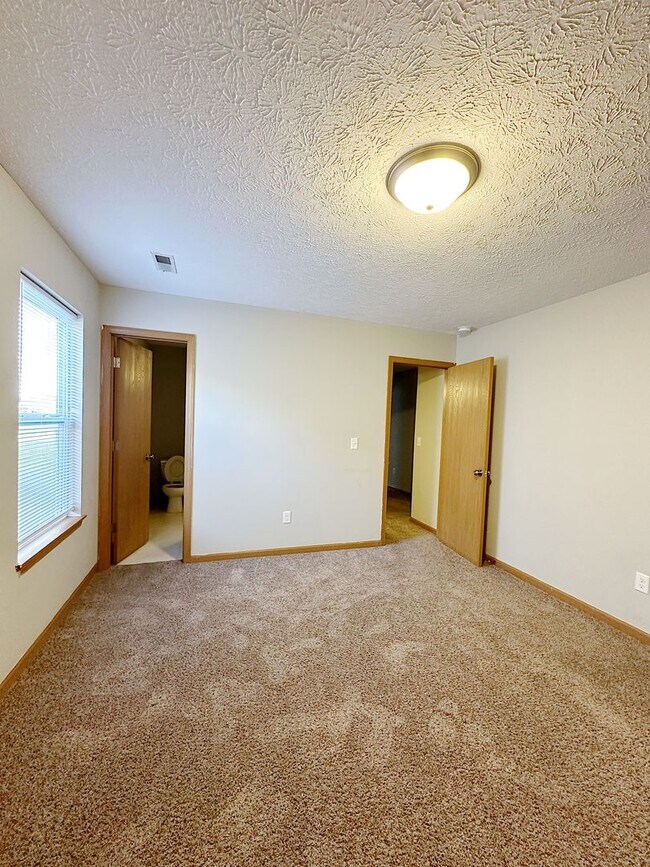 Building Photo - STUNNING Pond Views in this 2-Bed, 2-Bath Duplex