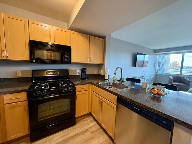 Building Photo - Fully Furnished Waterfront Studio That Lives Like a 1-Bedroom | SW DC