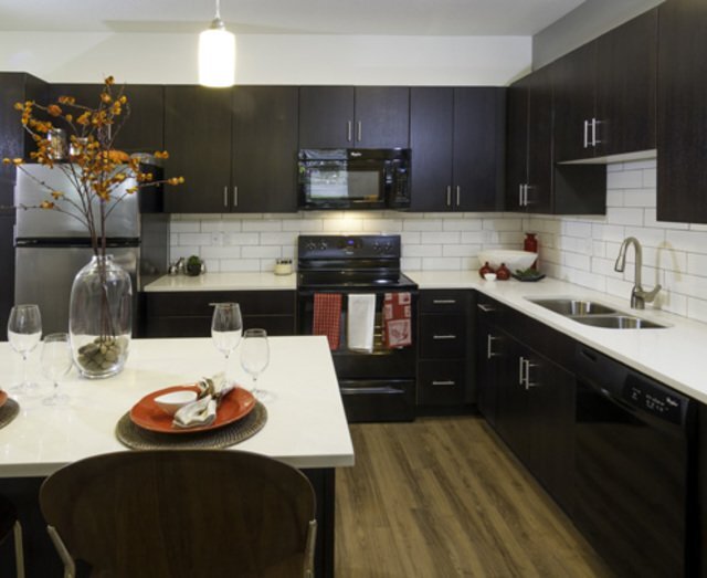 Kitchen With Ample Storage - Lofts at 7800 Apartments