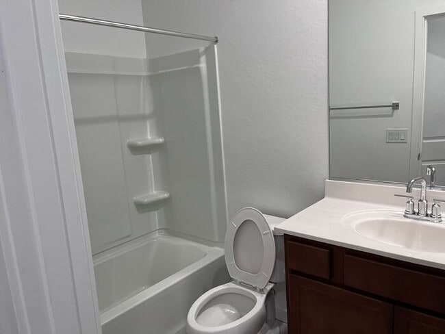 Building Photo - TOWN HOME WITH COMMUNITY POOL , GATED COMM...