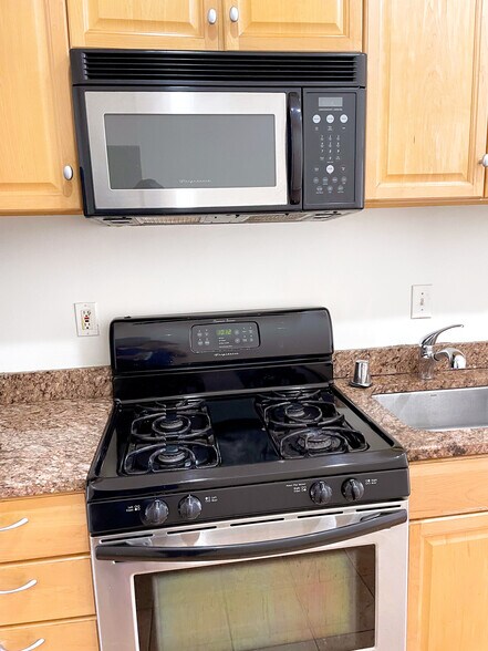 Granite countertops and stainless steel appliances - 803 7th St NE