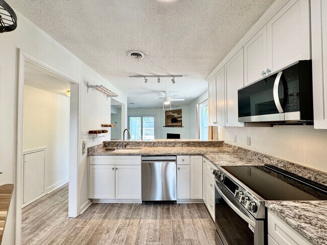 Building Photo - Ready NOW! A Custom Townhouse-Style Duplex Blocks to the Beaches! Fenced Yard - Hot Tub - Pet Fri...