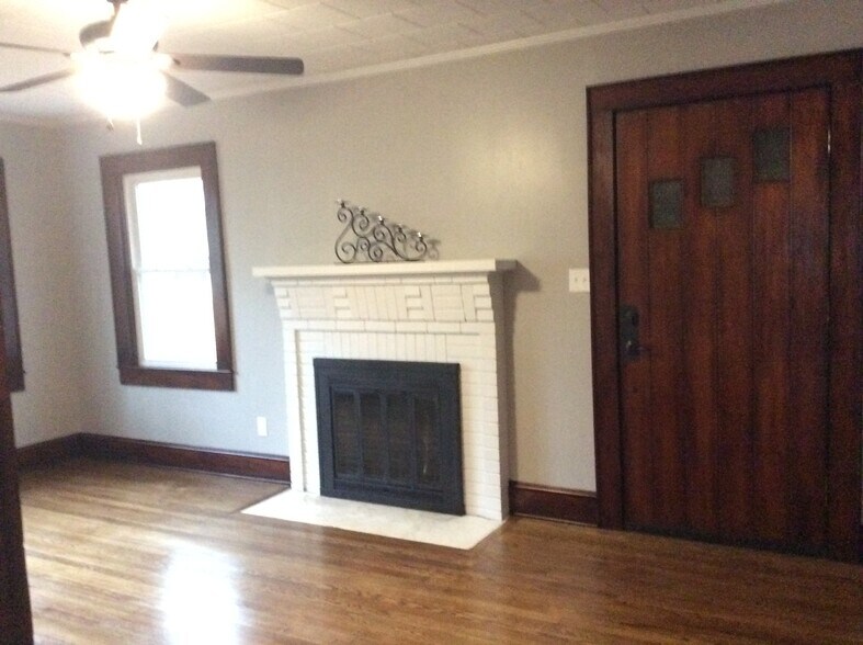 Family Room with cozy fireplace and bright windows - 361 W Wilson Ave
