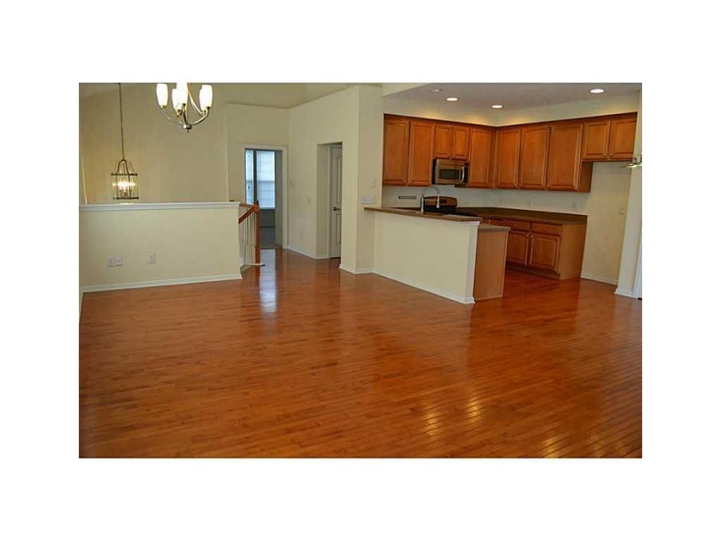 Top Floor, Living Room/Family Room. View-Facing Entrance, Master Bedroom, Half-Bath, and Kitchen. - 12668 Hollice Ln