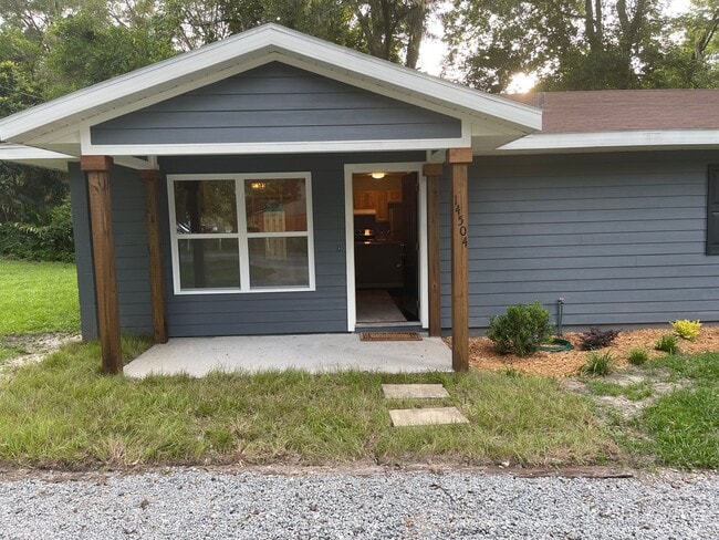 Building Photo - Welcome to this beautifully remodeled 2-bedroom duplex located in Alachua, conveniently situated ...