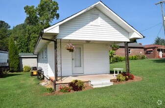 Building Photo - Charming, Partially Furnished Cottage-Styl...