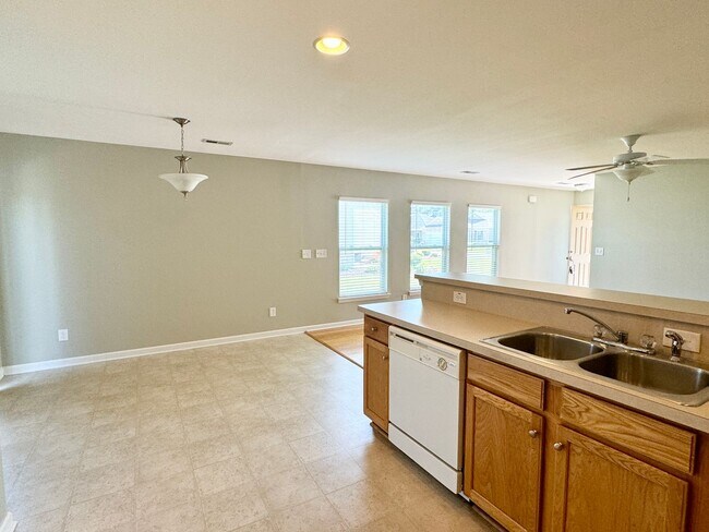 Building Photo - Like New 3 Bedroom & 2 Bath pond front home in Hillsborough! Enjoy the Community Pool, Playground...