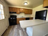 Building Photo - Wonderful Two Bedroom Townhouse in Perfect Plum Location! Private Patio, Garage & More! Call Today!