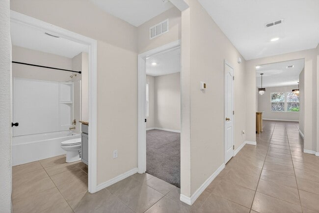 Building Photo - Available Now in Tavares | 2023 Built 4BR/2BA Home with 2-Car Garage