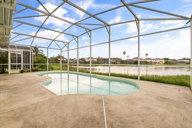 Building Photo - Stunning 4-Bedroom Lakefront Pool Home in Bridgeview at Meadow Woods