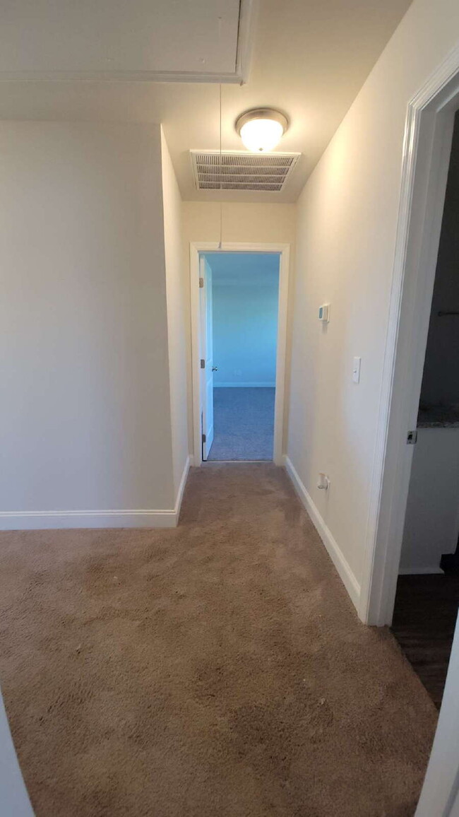 Building Photo - "Spacious 4-Bedroom Retreat with Modern Gr...