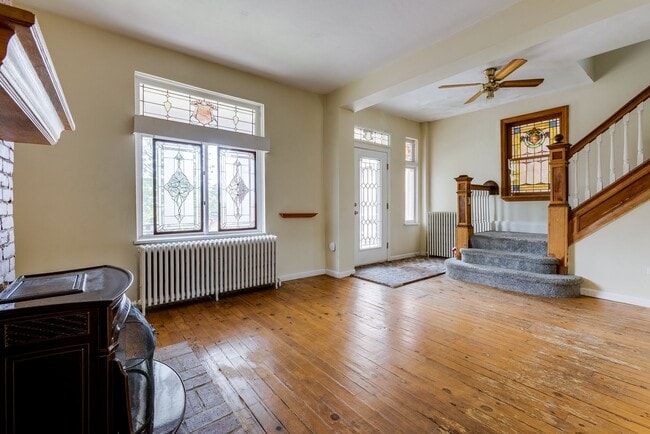 Building Photo - AVAILABLE June 2026 - Beautiful 4 Bedroom, 2 Bath Home w/ Front Porch Swing!