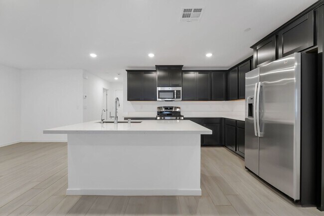 Building Photo - Modern Cadence Townhome with Sleek Finishes & Open-Concept Living!