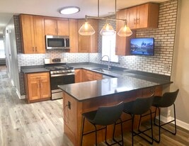 New cabinets, 42” uppers with under lit cabinets, all new S/S Appliances with outdoor vented hood. - 771 56th St