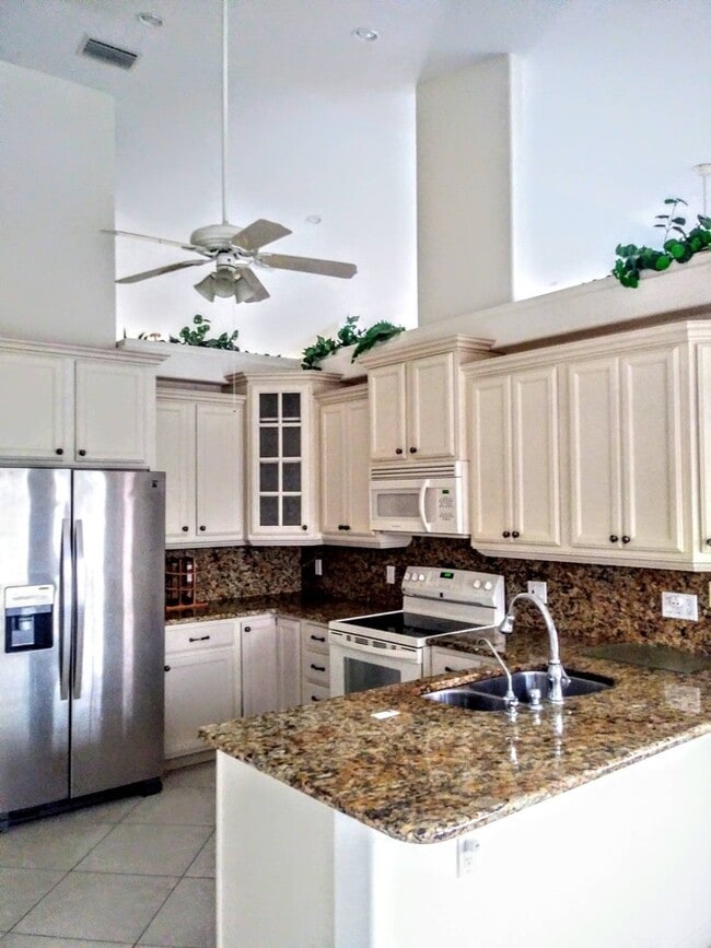Building Photo - ENJOY LIFE IN THIS 4 BEDROOM UNIQUE LAKE V...