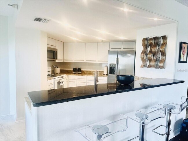 Building Photo - 5950 Pelican Bay Plaza S