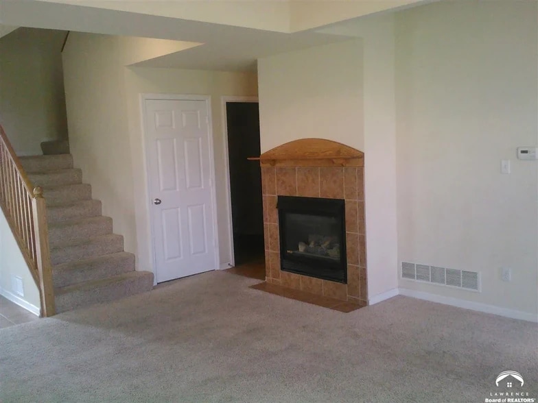fireplace and stairs - 2427 Surrey Dr