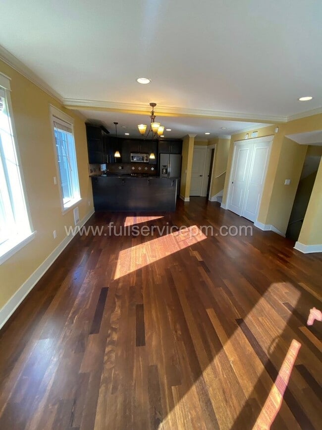 Building Photo - Spacious townhome with private backyard, garage parking, multiple decks, and a dedicated home off...