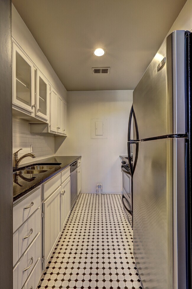 Black and white galley kitchen - 1 S Prado NE