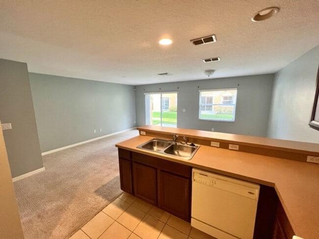 Building Photo - AVAILABLE NOW! Charming 2 Beds 2.5 Bath Townhome! 2 MASTER SUITES! Attached one car garage!! Extr...