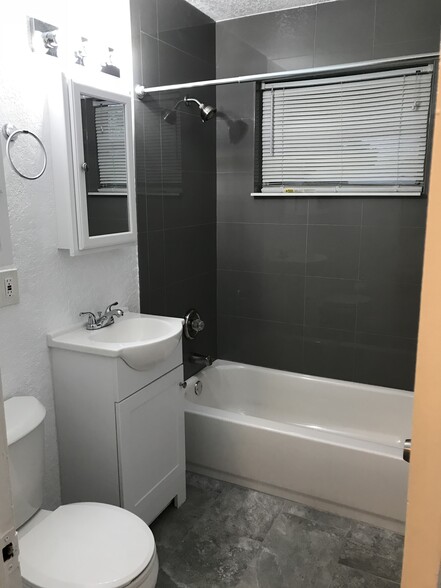 Bathtub, toilet, sink, mirror, tile, etc) - 128 NW 13th Avenue