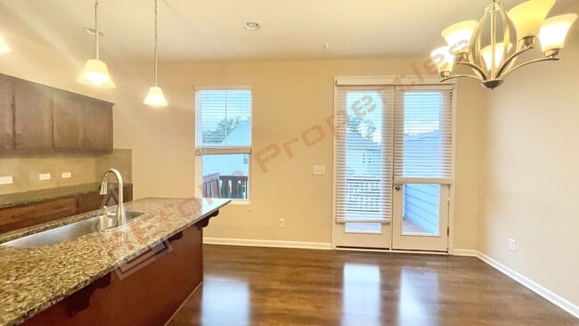 Building Photo - 3 Story Townhome 3 Bedrooms Rear Entry 2 Car Attached Garage with 1st Floor Bedroom, Community Po...