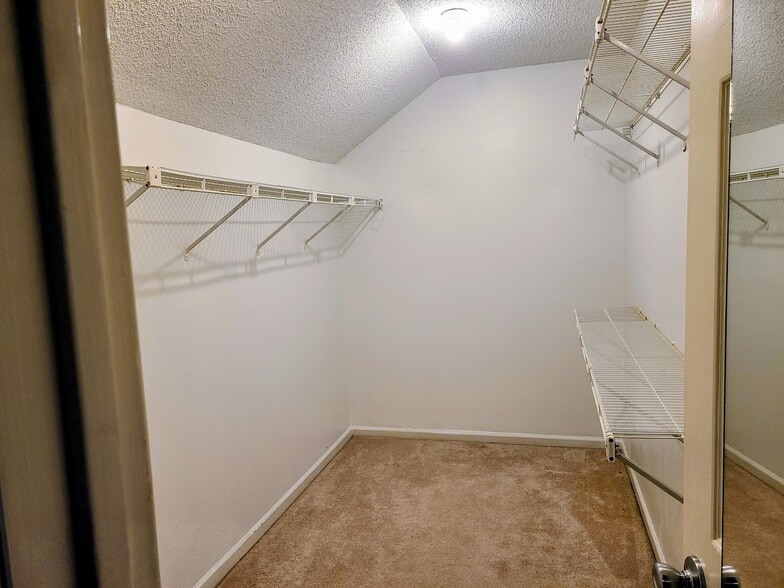 Master Bedroom Walk-In Closet with attic access for holiday decoration storage - 12439 Coursey Blvd