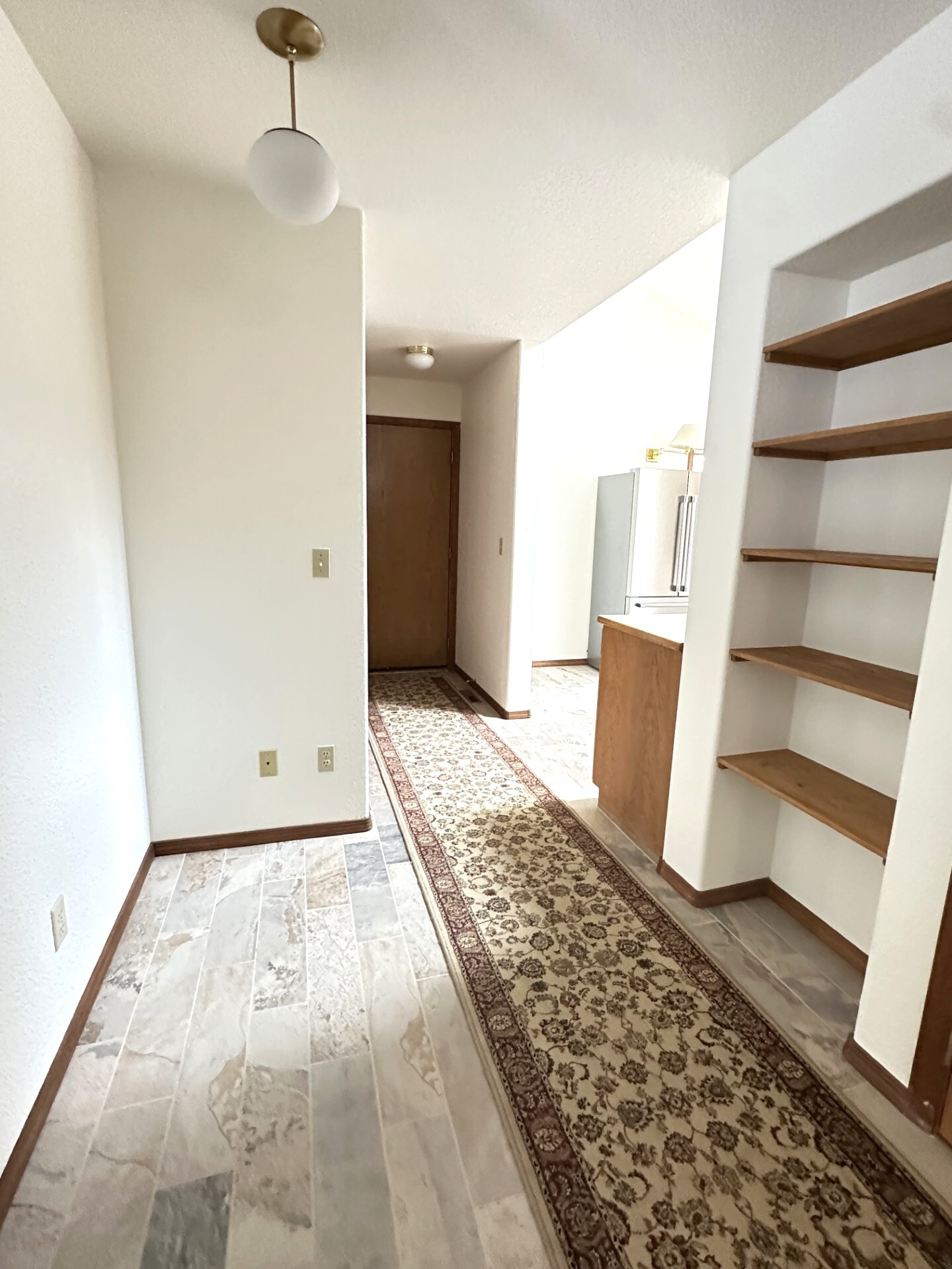 LEFT SIDE OF FRONT ENTRY LOOKING TOWARD GARAGE, KITCHEN, LAUNDRY - 10680 Manastash Rd