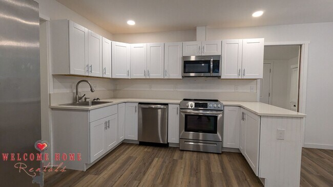 Building Photo - 4 bedroom home with air conditioning - Great location!!!  HUGE basement for your man cave or she ...