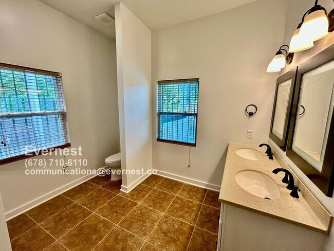 Building Photo - Spacious 4-Bedroom Home with Front Porch a...