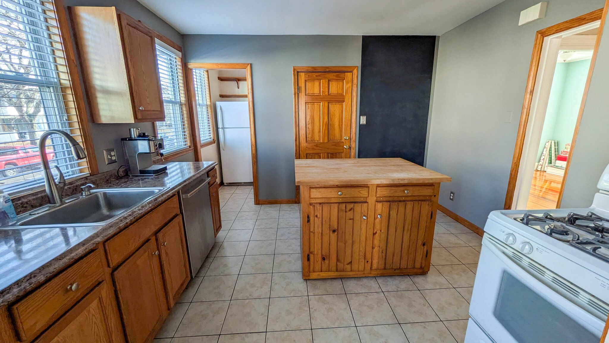 Kitchen with butcher block island, gas cooking and rare walk-in pantry offering excellent storage - 37 Glover Ave