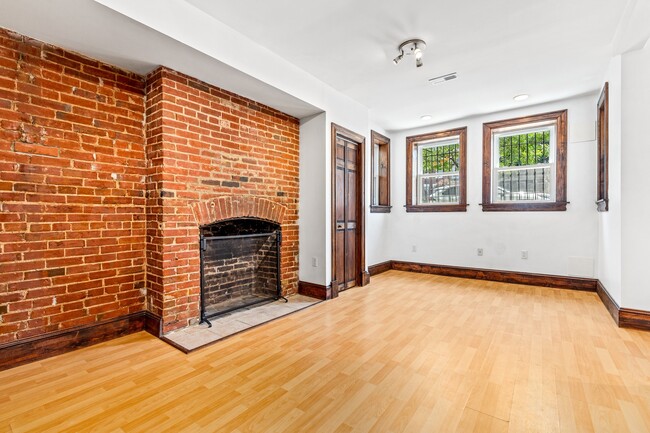 LR/DR w/bay windows, coat closet and fireplace - 39 New York Ave NW