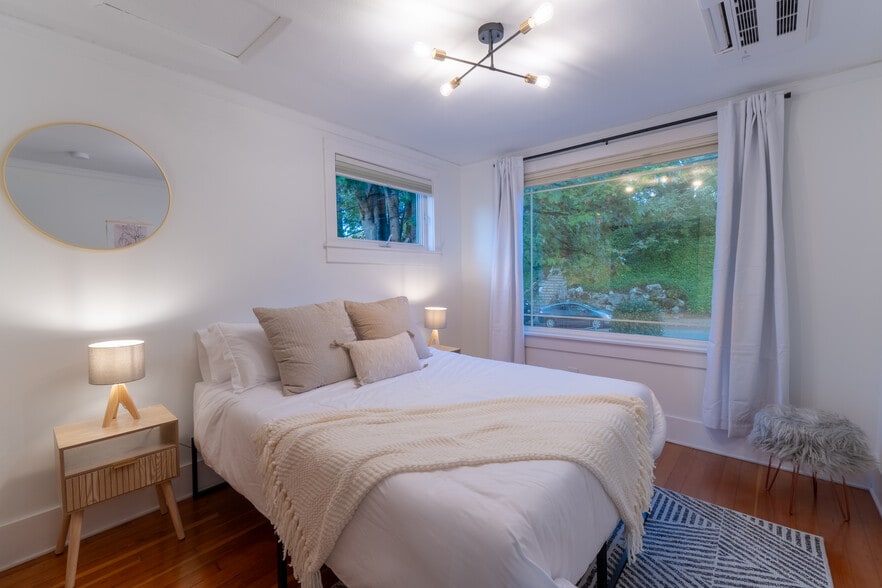 Queen sized bed with different pillow choices for a good night's rest. - 1519 32nd Ave