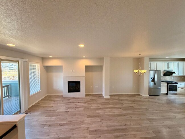 Building Photo - Move-In Ready 3-Story Townhome with Loft & 2-Car Garage