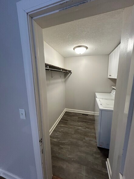 Laundry with extra storage. - 950 29th Ave NE
