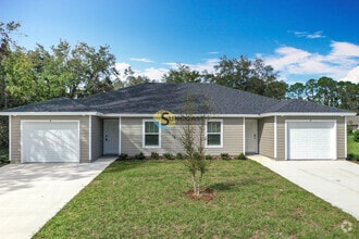 Building Photo - **Welcome to Your New Home in Palm Coast!**