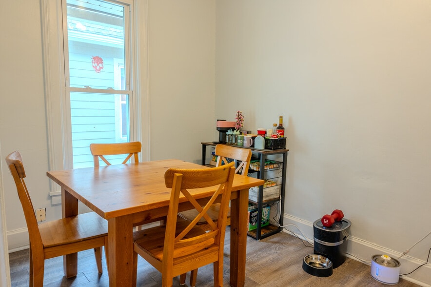 Enjoy meals in this spacious dining room with a window. - 1534 N Marshall St