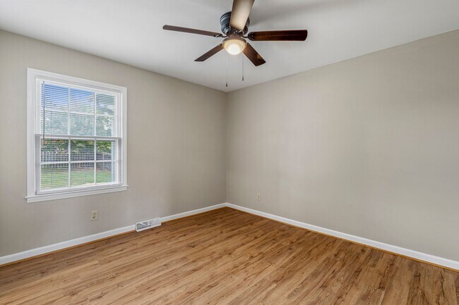 Building Photo - Large Renovated Ranch Home, Two Kitchens & Two Living Areas, Hardwood Flooring, Deck, Fenced!