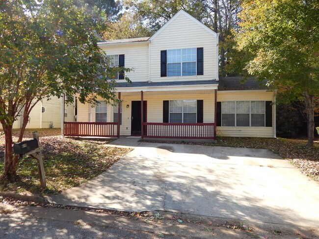 Building Photo - Freshly painted and new flooring in this 4 Bedroom 2 and Half Bath home. Covered front porch with...