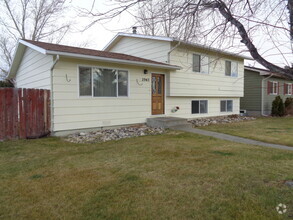 Building Photo - 4 Bedroom House with Newer Carpet and over...