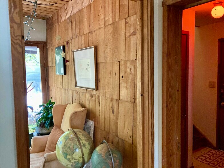 shingled sunroom (3 of 4 walls) made from date crates - 341 Glendale Ave NE