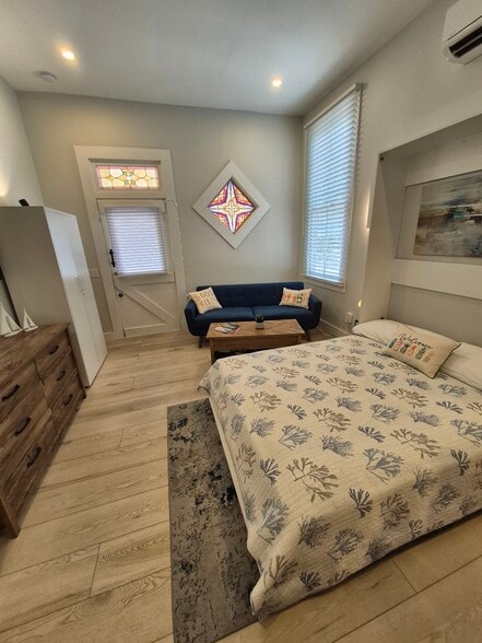 Living room with Murphy bed open - 1220 Newton St