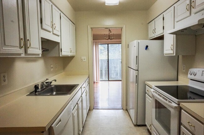 Building Photo - Beautiful brick townhome featuring three f...