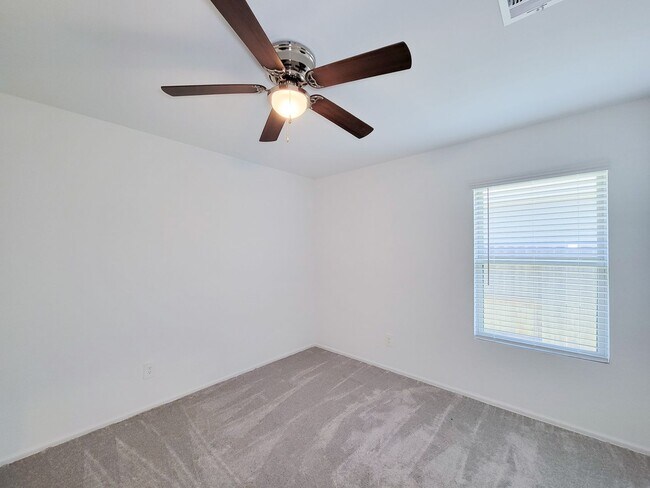 Building Photo - This single-story home has a comfortable layout with three bedrooms and a living area all on one ...