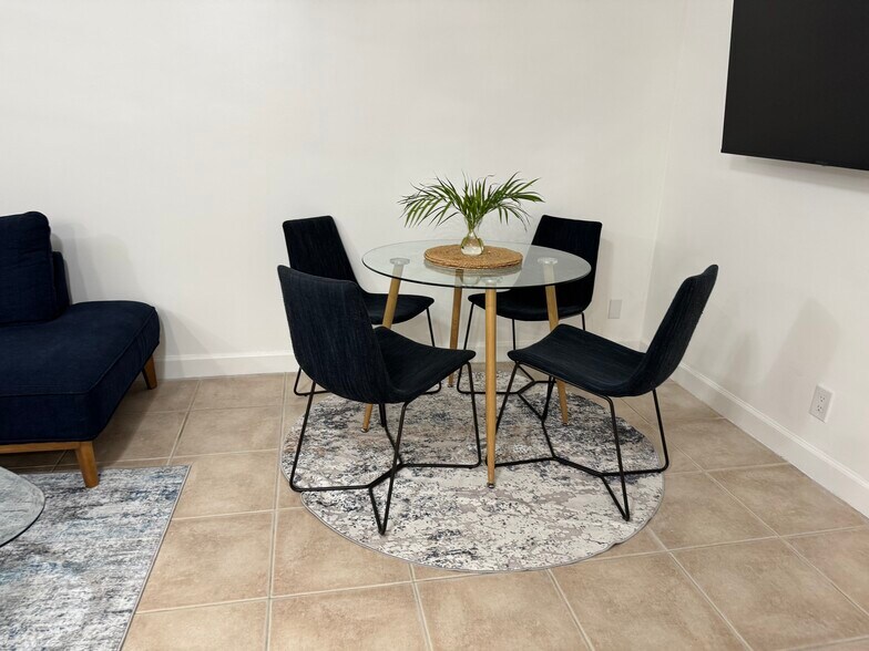 I changed the dining room chairs so I added them to this picture - 1220 NE 5th Ter